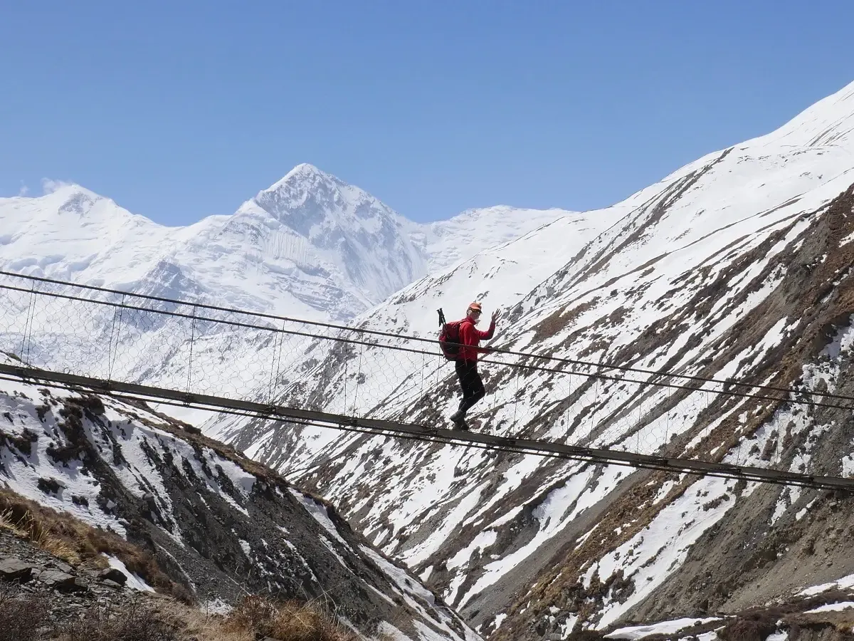 crossing suspension bridge on the annapurna circuit trek