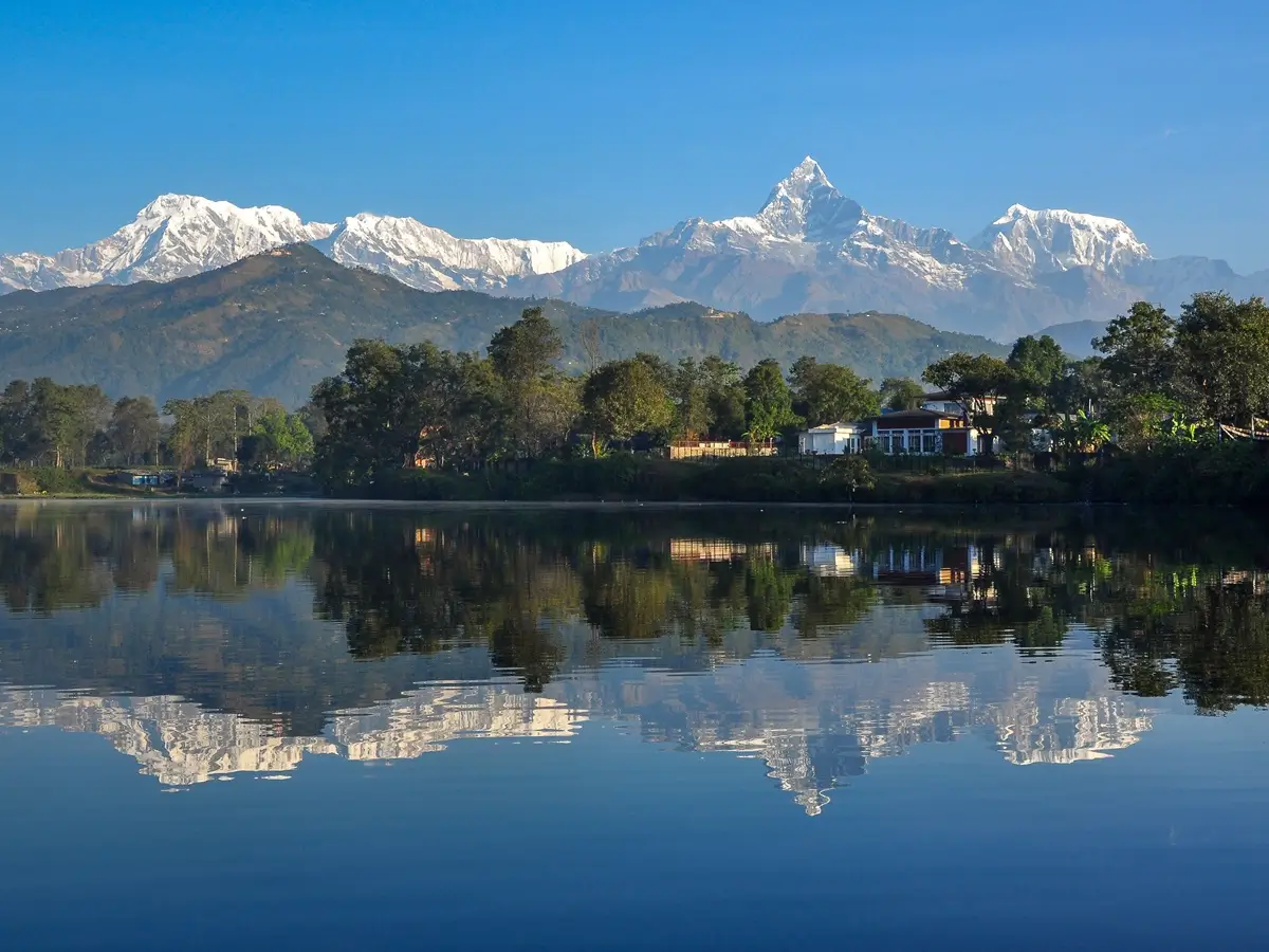 Annapurna mountain range reflected in Phewa Lake