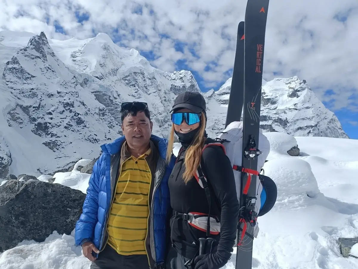 Guide and client standing on snowy terrain during a Mera Peak trip